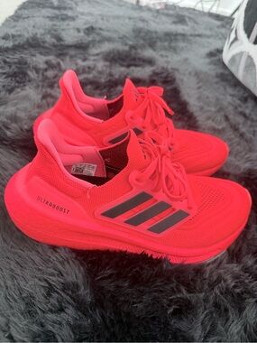 adidas red orange Ultraboost Running Sneakers.